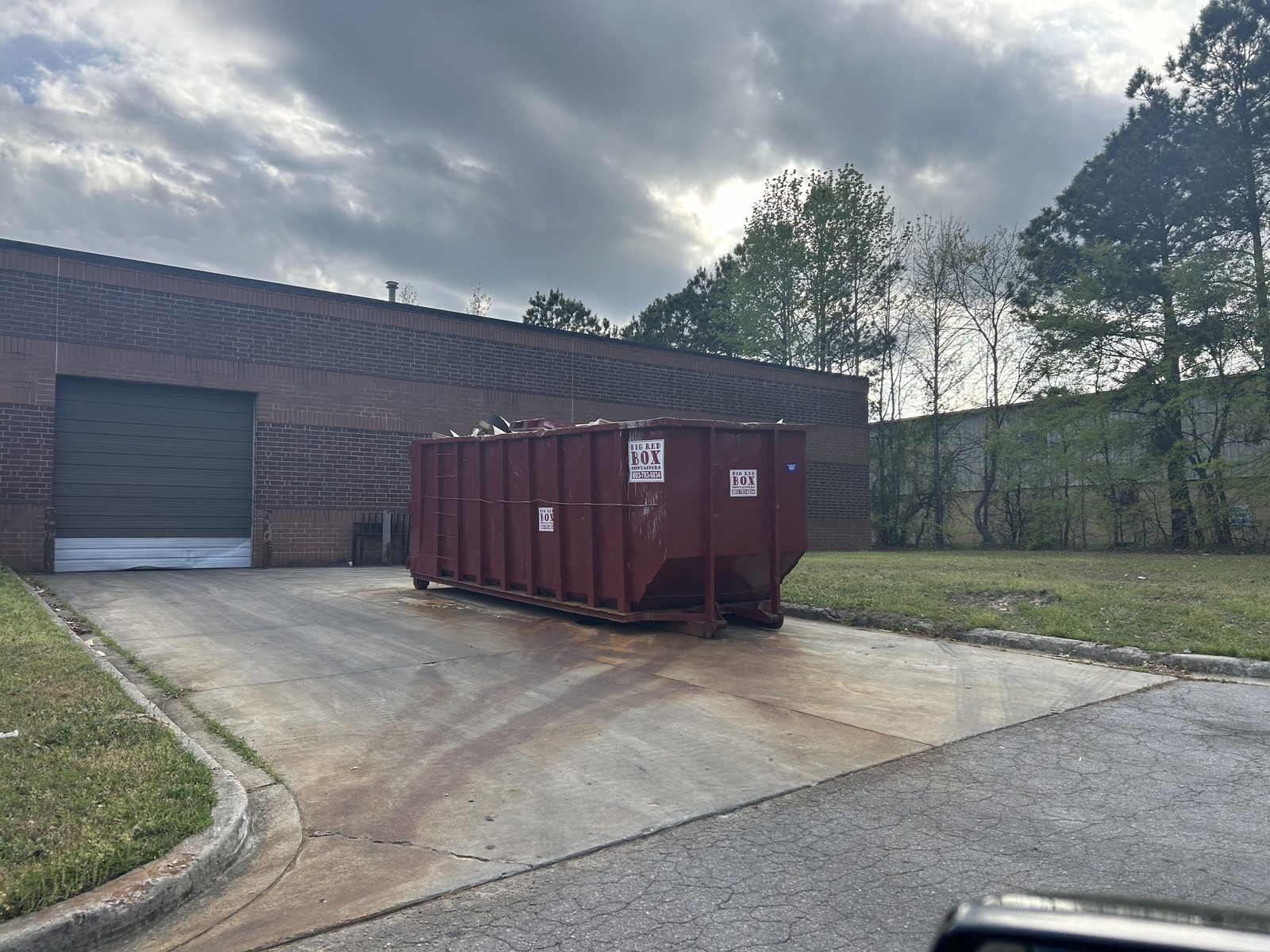 Big Red Box roll-off dumpster on a commercial cleanout job in Columbia, SC